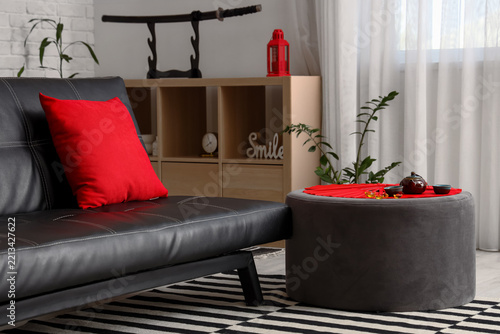 Interior of modern living room with black sofa and decorations for Chinese Ne...