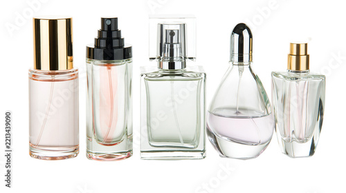Isolated collection of elegant glass perfume and fragrance spray bottles for beauty product photography