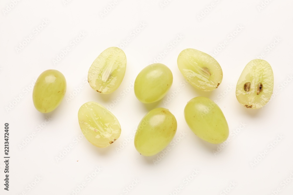 Fototapeta premium Fresh ripe grapes on white background, flat lay