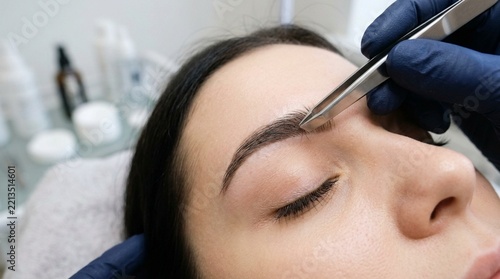 Brow Shaping with Tweezers in Beauty Salon