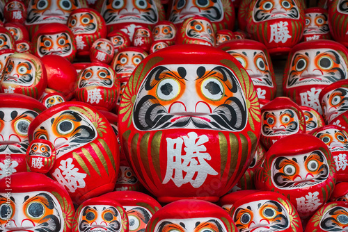 Stack of Daruma doll figures on shelf decor at Katsuo-ji temple,  Osaka