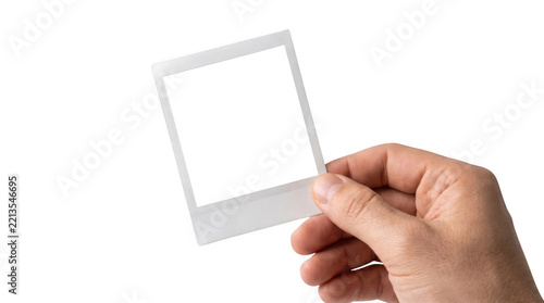 Blank polaroid photo held by hand isolated on transparent background