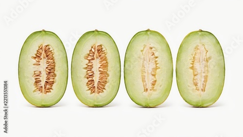 Four melon halves with seeds arranged linearly isolated on white background. Perfect for healthy food concepts and recipe banners.