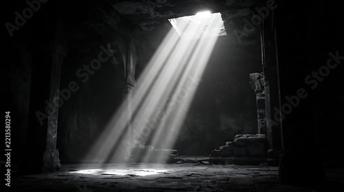 Dramatic sunlight beams piercing through a dark underground stone ruin