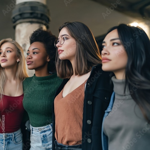 Group of Women Posing Together at a Location With Urban Decor in the Background