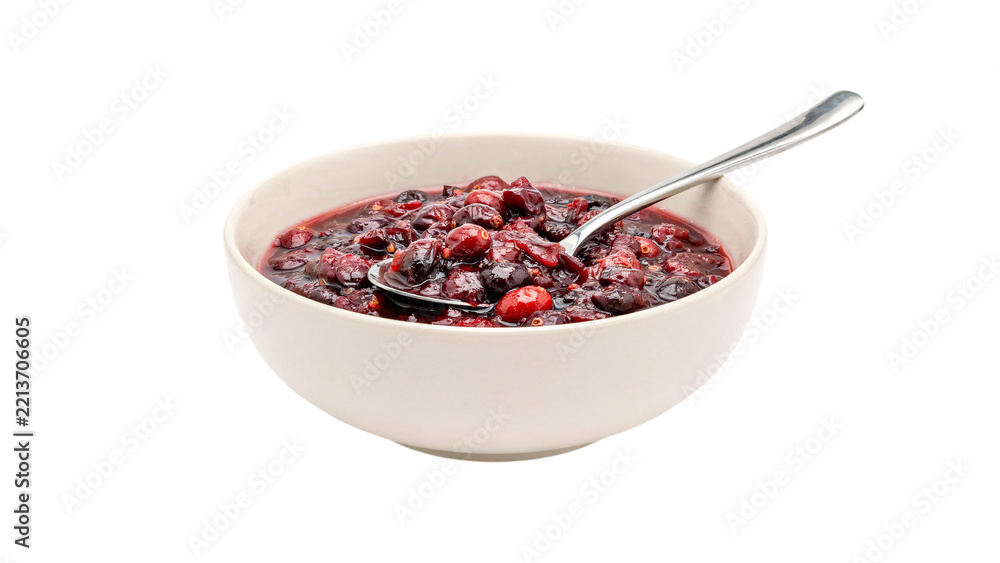 Fototapeta premium Bowl of cranberry sauce with spoon isolated on transparent background