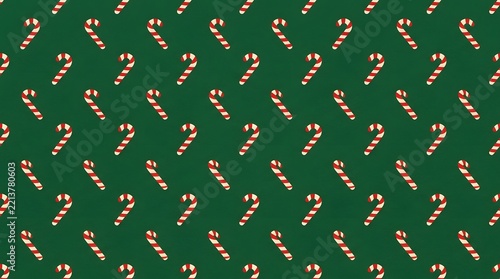 Colorful candy cane pattern on dark green seamless background