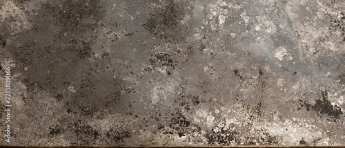 Silver patina on an antique mirror surface with a weathered, mottled texture and dark speckles for vintage backgrounds and overlays