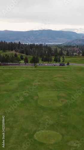 Vertical drone view over scenic golf course landscape