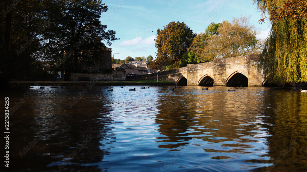 Fototapeta premium Old stone bridge over a river in the Peak District