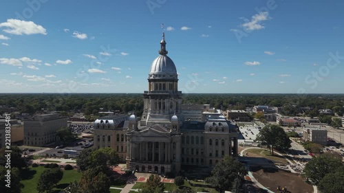 Illinois State Capitol drone shot - the drone is backlit by the sun
