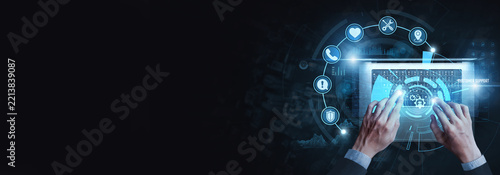 Technical Support Specialist using laptop to analyze Customer support data on digital interface, troubleshooting, service assistance, helpdesk operations, client communication, technical solutions.