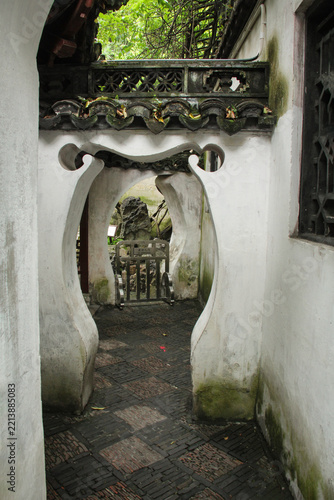 Photography Narrow white plaster corridor entrance in Shanghai garden
