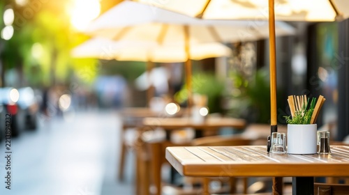 Charming Street Cafe View of Street cafe outdoor with umbrellas casting soft shade summer