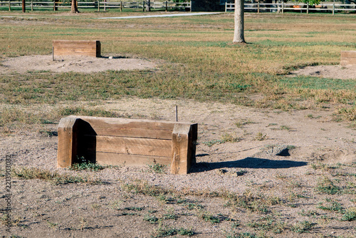 Wooden obstacles on a dry park field