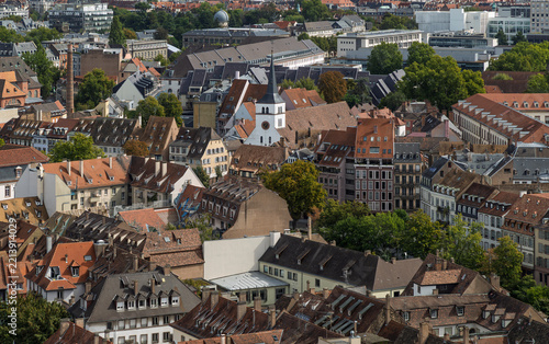 Fotografie Saint-Guillaume Church and rooftops in Strasbourg, France