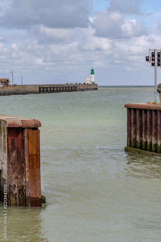 Fototapeta premium Views of Le Treport, seaside resort in Normandy, France, with white cliffs along English Channel, fishing industry and old buildings, travel destination in France