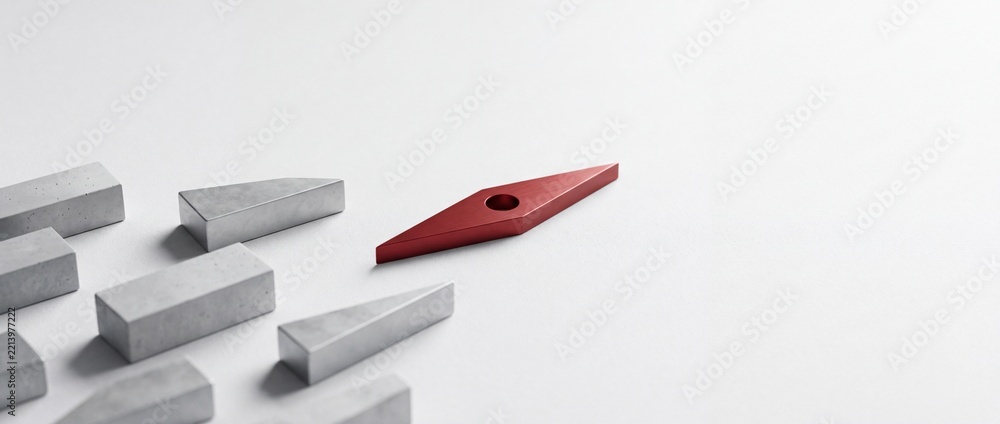 Fototapeta premium Minimalist conceptual business metaphor showing a red compass needle leading a group of gray concrete blocks on a white background, symbolizing leadership, vision, and strategic direction.