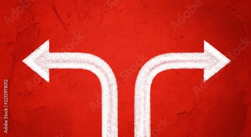 White arrows diverging on a distressed red wall surface