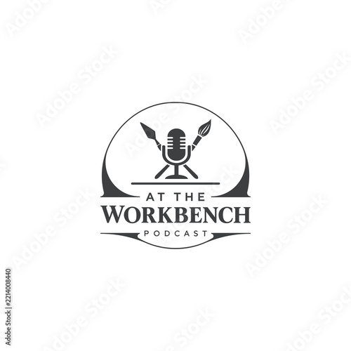A creative logo featuring a dark grey microphone, a crossed paintbrush and a palette knife in a warm grey colour, all set against a white background. This logo would be perfect for an artisan podcast.