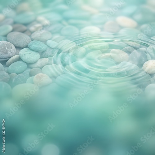 Smooth Pebbles Under Clear Aqua Water Rippling in Shallow Pool with Soft Natural Light
