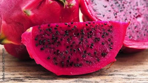 Ripe red dragon fruit on wood