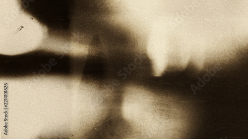 Cinematic film grain texture with soft light leaks, vintage analog photography aesthetic on dark background, subtle noise overlay for retro video editing, filmmaking, nostalgic visuals