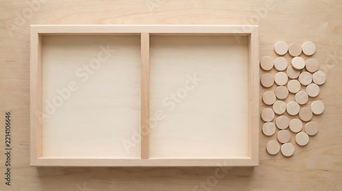 Natural light wood board game with divided tray and round tokens placed on a plywood table surface.