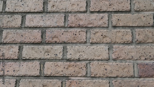 Beige brick wall texture with horizontal masonry pattern