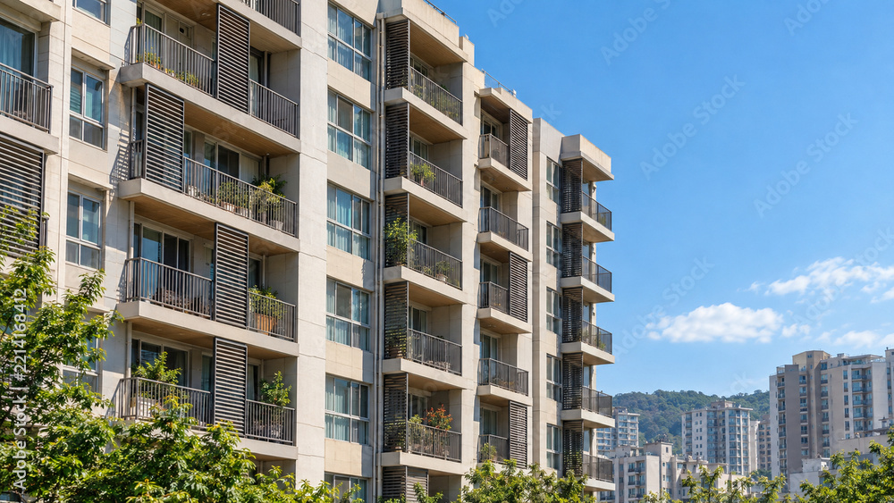 Fototapeta premium Apartment building with exterior louvers for passive cooling