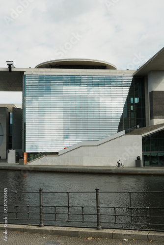 Modern Glass Building by a Canal
