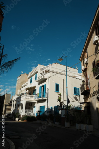 White Residential Buildings with Blue Trim