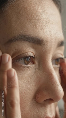 Close Up Portrait of Mature Woman Checking Skin Elasticity and Wrinkles on Face for Skincare and Cosmetic Treatment Concept