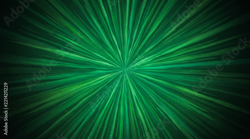 Abstract green light rays radiating from center in a dark background