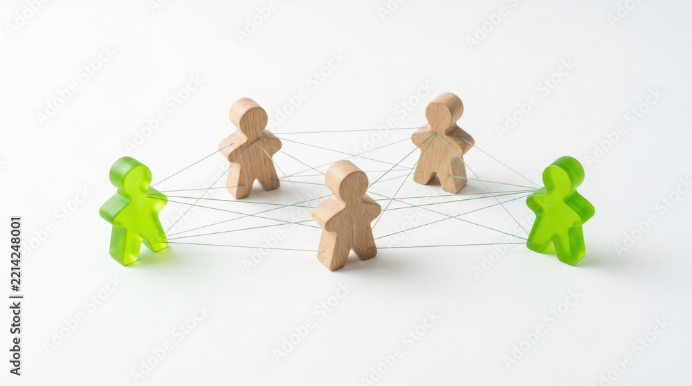 Obraz premium Two wooden figures standing between two green translucent people connected by thin lines to visualize social networking ties.