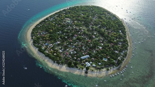 Aerial view of tropical island Balicasag surrounded by turquoise waters and coral reefs, Philippines, 4k