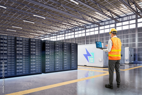 Engineer work at data center with energy storage systems or battery container units