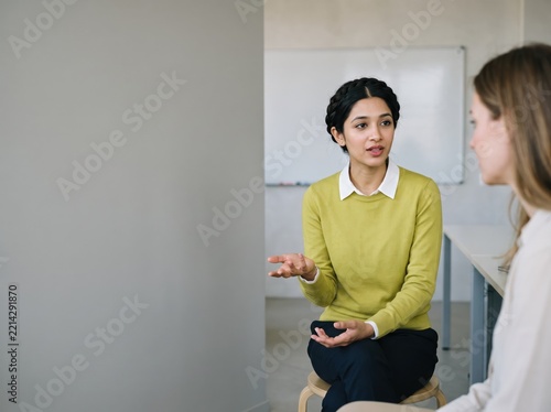 Generative AI, Indian woman gesturing during a one-on-one counseling session