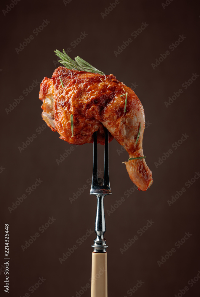 Fototapeta premium Chicken drumstick on a fork.