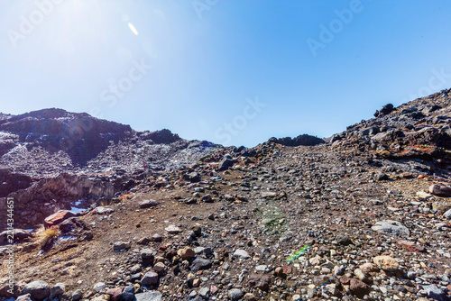 Rocky Volcanic Trail Beneath Clear Alpine Sky