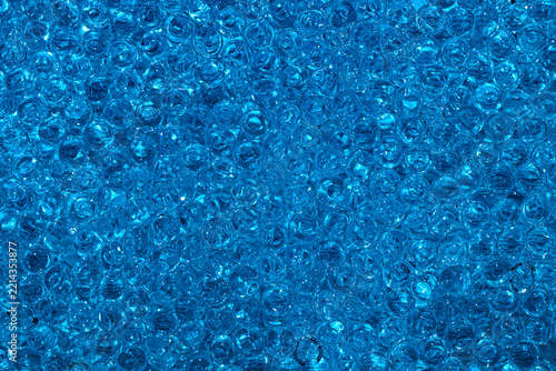 blue liquid pearls glossy background