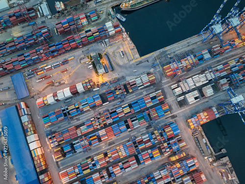 Aerial View of Commercial Container Port with Cargo Ships and Logistics Terminal