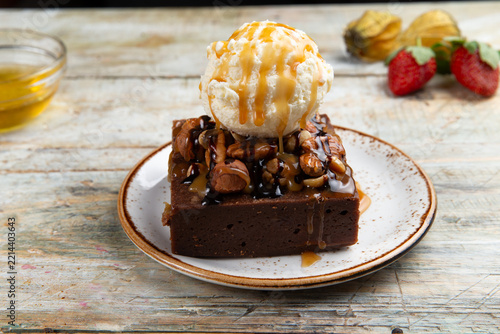 Chocolate brownie with vanilla ice cream and caramel sauce food