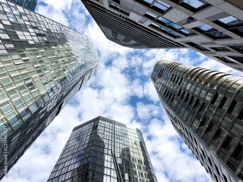 reflective modern office buildings under blue sky 