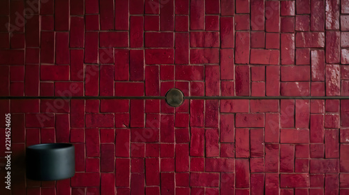 Abstract red wall texture with geometric pattern and subtle lighting effects
