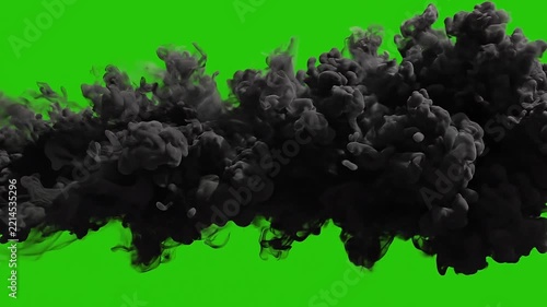 A thick black smoke cloud billowing and expanding across a solid green screen background, perfect for VFX transitions, disaster, and special effects.