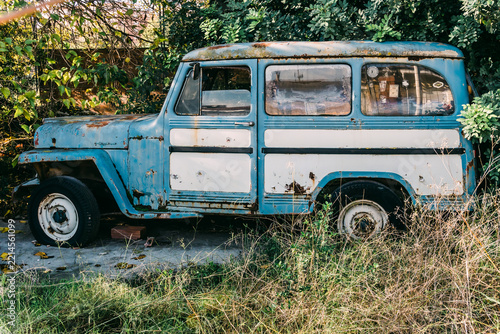 Rusty blue and white vintage off-road vehicle