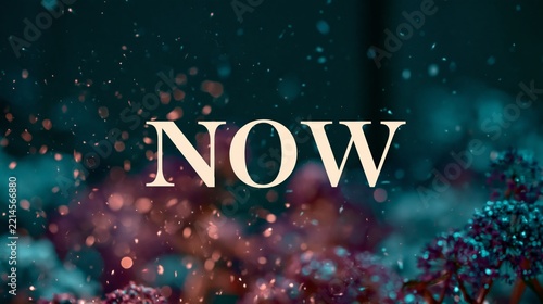 Word now in elegant white lettering over a dreamy teal and pink abstract background with glowing particles and soft bokeh