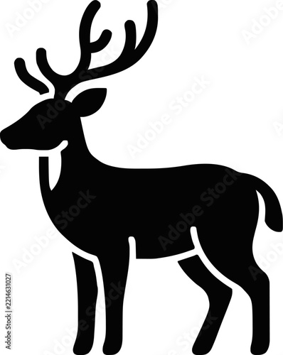 Black silhouette of a majestic deer with large antlers standing in profile