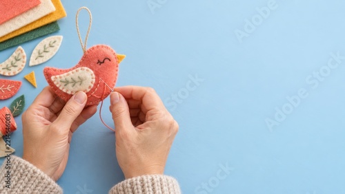 Sewing a Coral Felt Bird Ornament with an Embroidered Cream Wing